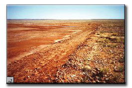 Landscape - site remains as a prominent, consolidated surface with a distinct edge