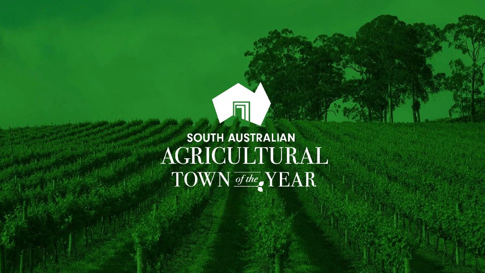 A green background of grapevine and trees with the text "South Australian Agricultural Town of the Year" in white.
